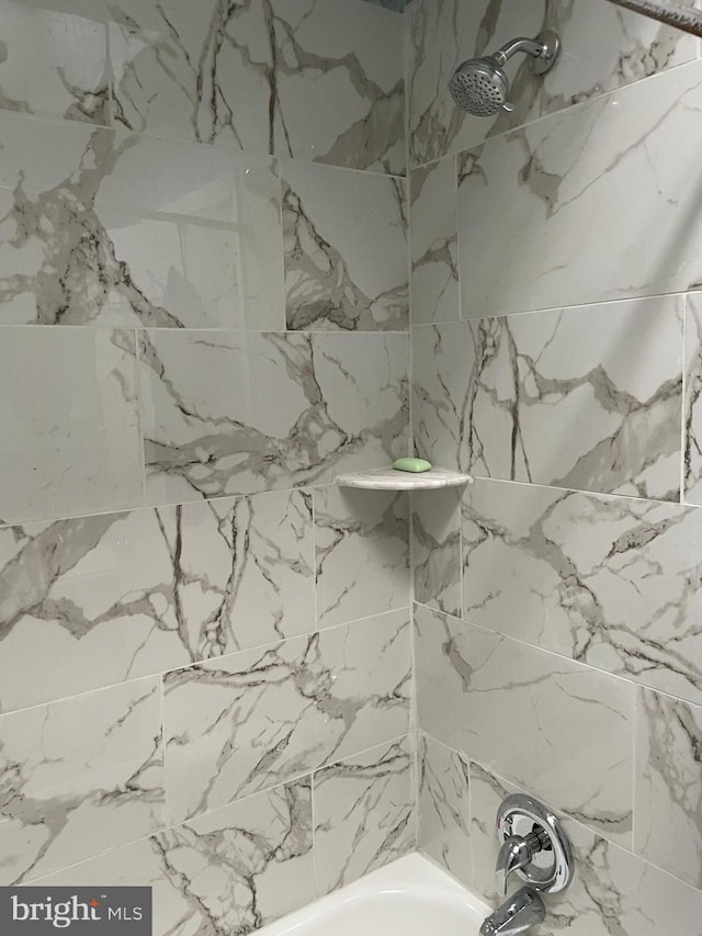 full bath featuring bathing tub / shower combination