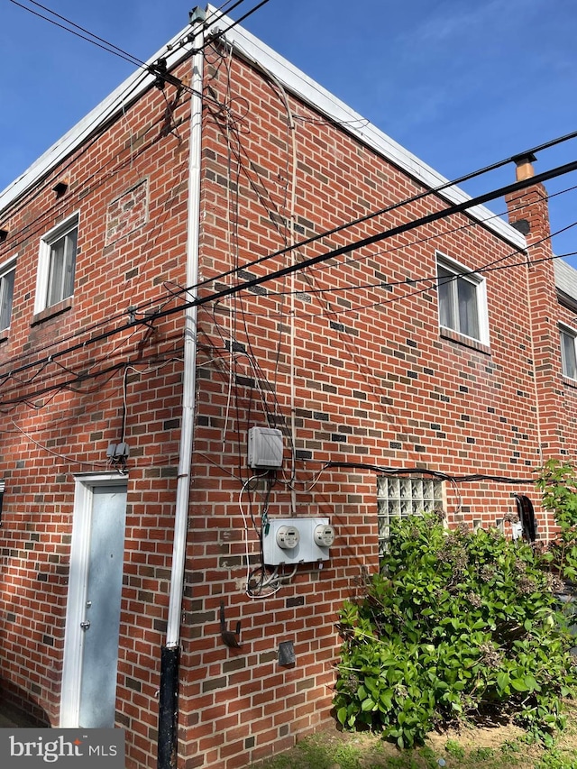 view of home's exterior featuring brick siding