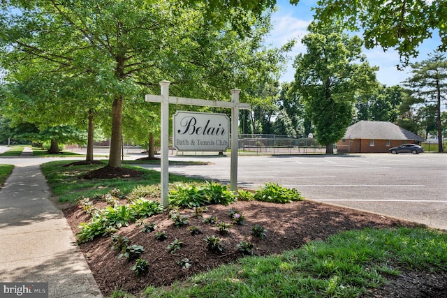 community sign featuring fence