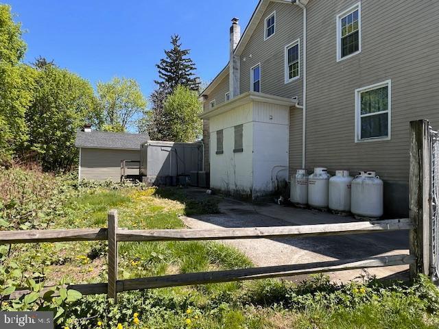view of side of property with fence
