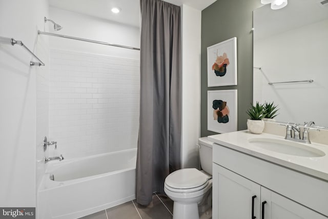 full bathroom featuring tile patterned floors, shower / bathtub combination with curtain, vanity, and toilet