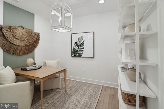 dining room featuring baseboards, recessed lighting, and wood finished floors