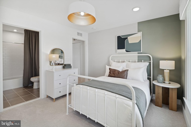 bedroom featuring ensuite bathroom, carpet flooring, recessed lighting, and visible vents