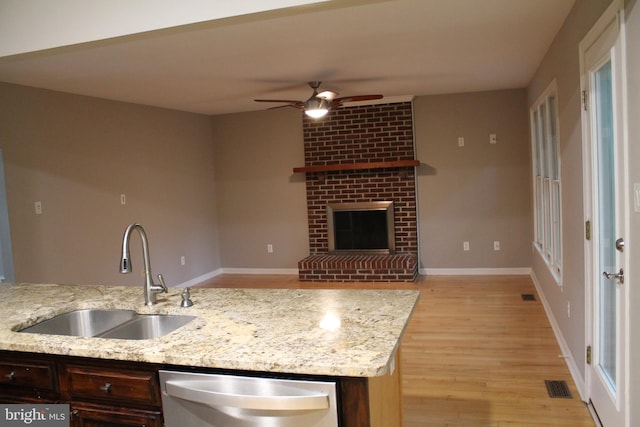 109 Hamlin Dr, Fredericksburg, VA 22405 - kitchen with dishwasher, a sink, ceiling fan, light wood finished floors, and dark brown cabinetry