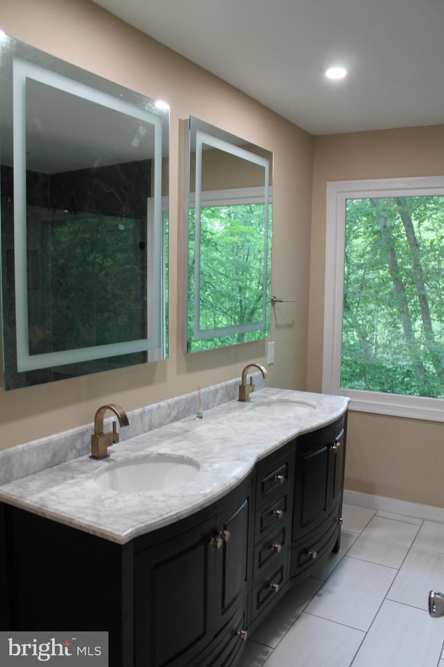109 Hamlin Dr, Fredericksburg, VA 22405 - full bathroom featuring healthy amount of natural light, double vanity, recessed lighting, tile patterned floors, and a shower