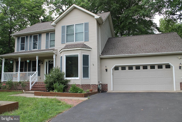 109 Hamlin Dr, Fredericksburg, VA 22405 - traditional-style house with asphalt driveway, a garage, a porch, and roof with shingles