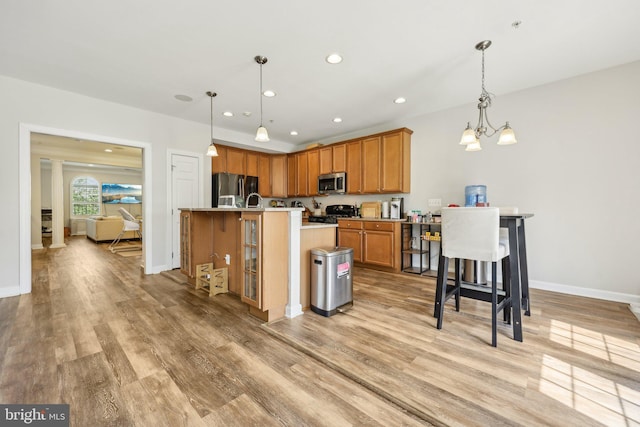 207 Community Center Ave Unit 207, Gaithersburg, MD 20878 - kitchen with recessed lighting, appliances with stainless steel finishes, and light wood-style floors