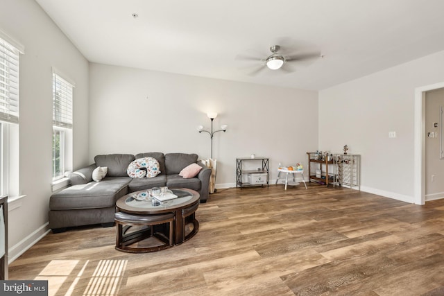 207 Community Center Ave Unit 207, Gaithersburg, MD 20878 - living area featuring a ceiling fan, baseboards, and wood finished floors