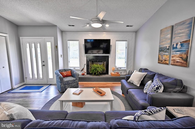 708 Radial Dr, Bethany Beach, DE 19930 - living room with a textured ceiling, a ceiling fan, wood finished floors, and visible vents