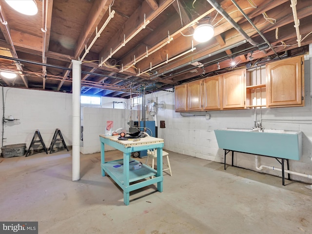 below grade area with a sink