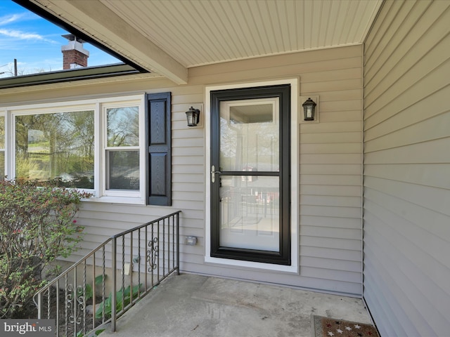 entrance to property with a chimney