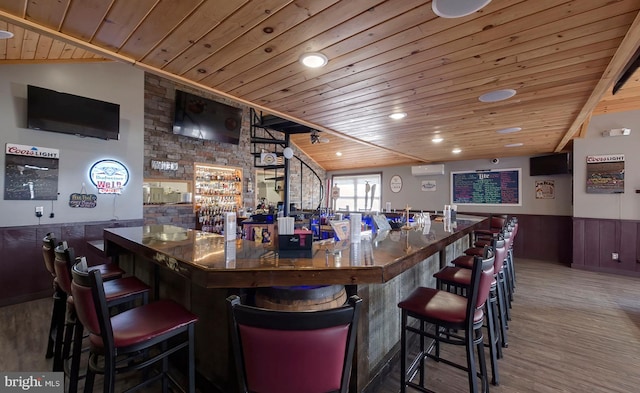 4547 Red Rock Rd, Benton, PA 17814 - bar with a bar, wood ceiling, a wainscoted wall, and wood finished floors