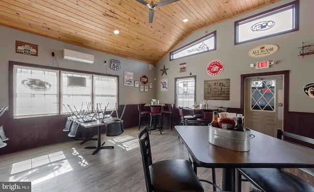 4547 Red Rock Rd, Benton, PA 17814 - dining area with a wall mounted air conditioner, wood ceiling, wood finished floors, and high vaulted ceiling