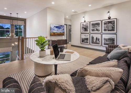 living room featuring recessed lighting and wood finished floors