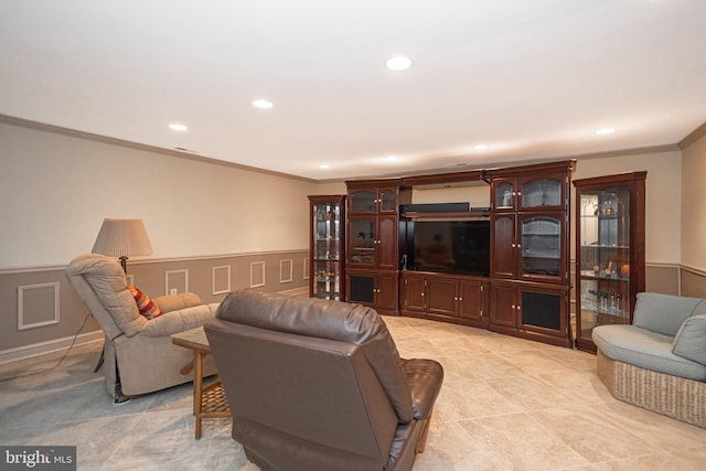 living area with recessed lighting, ornamental molding, a wainscoted wall, and light tile patterned flooring