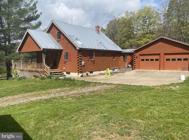 view of front facade featuring metal roof, a front yard, a chimney, and log siding
