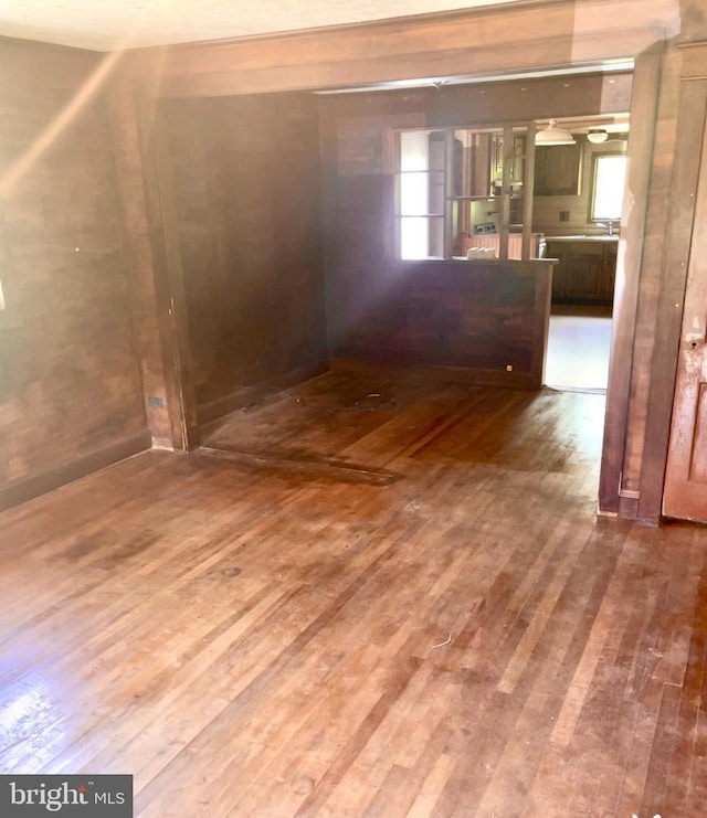 unfurnished room with hardwood / wood-style floors
