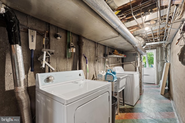clothes washing area with laundry area and washer and clothes dryer
