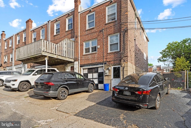 exterior space with a garage and brick siding