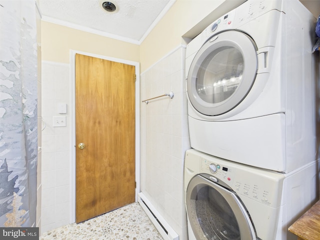 4105 Wilcox Ct, Pocono Lake, PA 18347 - laundry room with stacked washing maching and dryer, ornamental molding, a textured ceiling, and baseboard heating