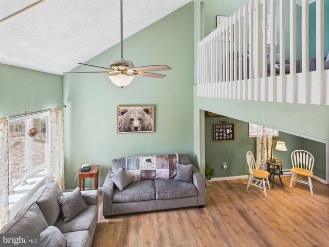 4105 Wilcox Ct, Pocono Lake, PA 18347 - living area with baseboards, wood finished floors, a ceiling fan, and high vaulted ceiling
