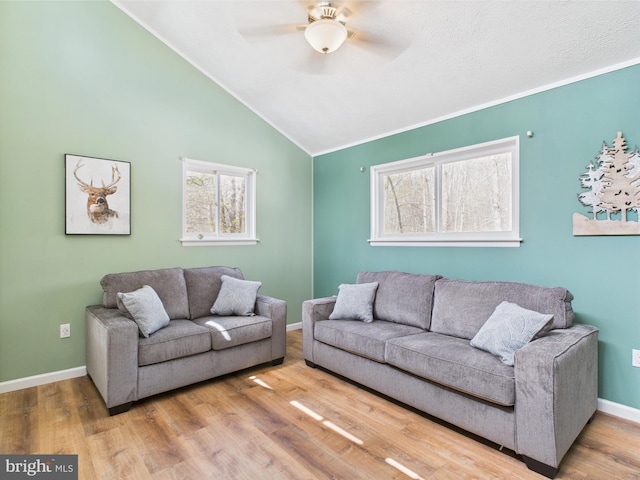 4105 Wilcox Ct, Pocono Lake, PA 18347 - living room featuring ceiling fan, lofted ceiling, crown molding, and plenty of natural light