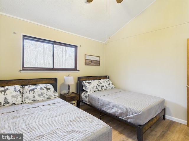 4105 Wilcox Ct, Pocono Lake, PA 18347 - bedroom with wood finished floors, ornamental molding, vaulted ceiling, a ceiling fan, and baseboards