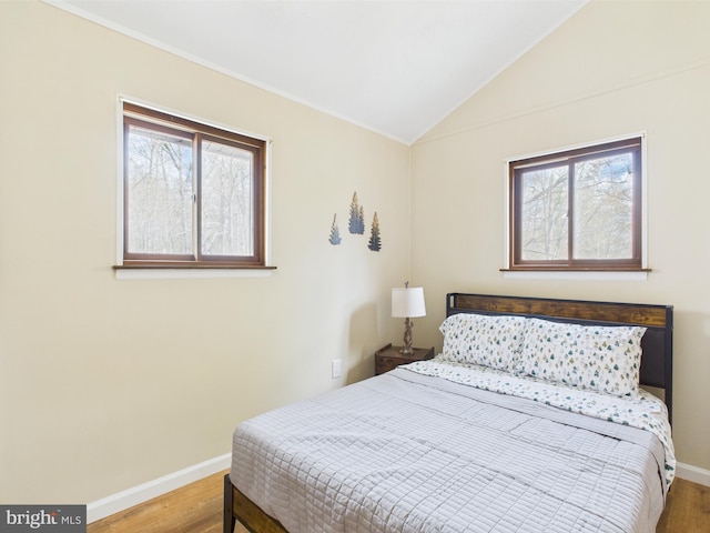 4105 Wilcox Ct, Pocono Lake, PA 18347 - bedroom with baseboards, lofted ceiling, ornamental molding, and wood finished floors