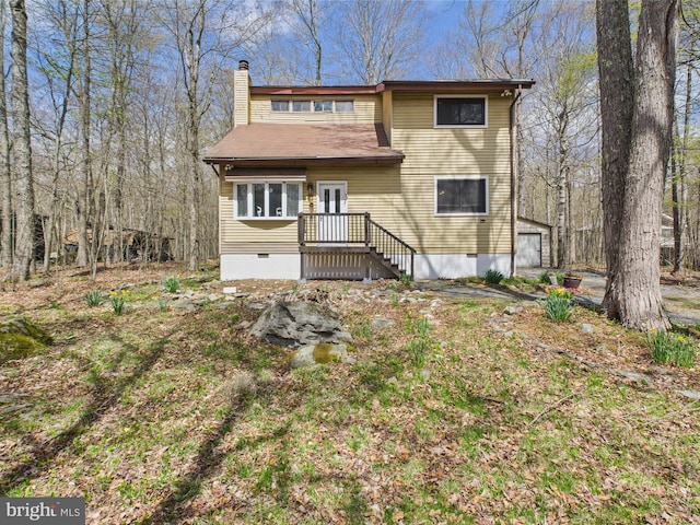 4105 Wilcox Ct, Pocono Lake, PA 18347 - back of house with an outdoor structure, crawl space, and a chimney