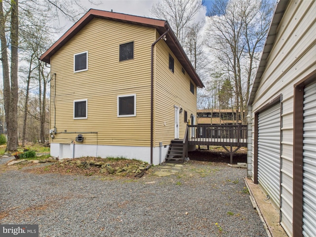 4105 Wilcox Ct, Pocono Lake, PA 18347 - view of side of home with a wooden deck