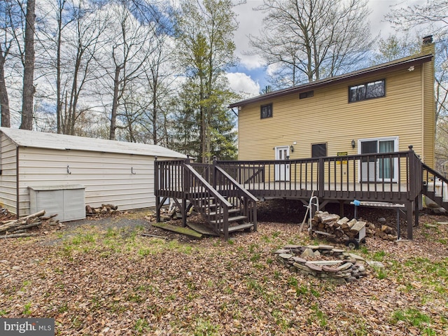 4105 Wilcox Ct, Pocono Lake, PA 18347 - rear view of property featuring a fire pit, a chimney, a deck, and stairway