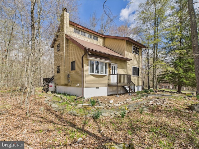 4105 Wilcox Ct, Pocono Lake, PA 18347 - rear view of property featuring a chimney