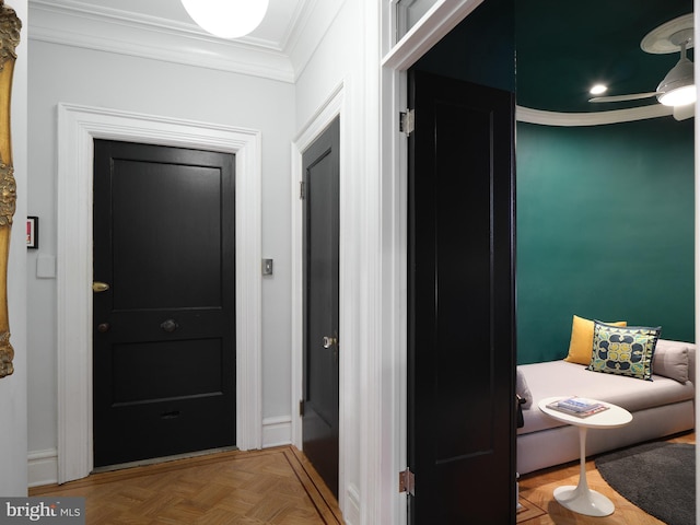 hall featuring baseboards and ornamental molding