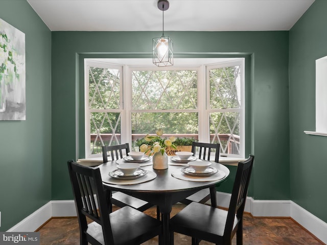 dining area featuring baseboards
