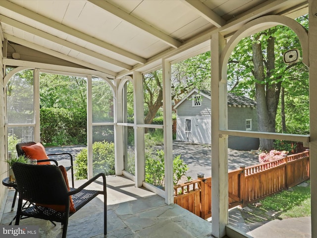 sunroom / solarium with beam ceiling