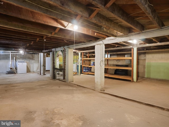 unfinished below grade area with washer / clothes dryer