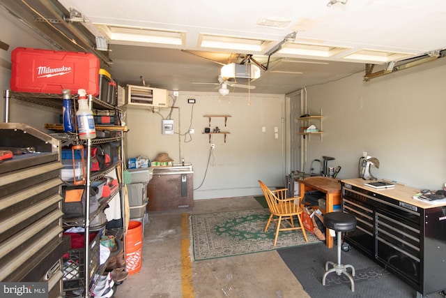 garage with a garage door opener and a workshop area
