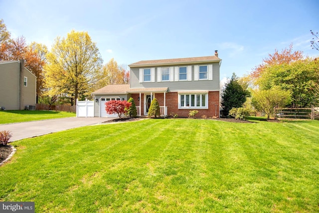 traditional-style house featuring a chimney, a garage, brick siding, fence, and aphalt driveway