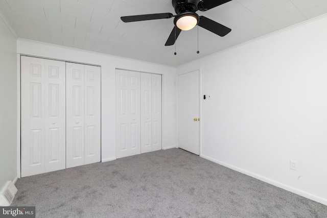 1414 Simpson St, Marcus Hook, PA 19061 - unfurnished bedroom with multiple closets, carpet, baseboards, visible vents, and ornamental molding