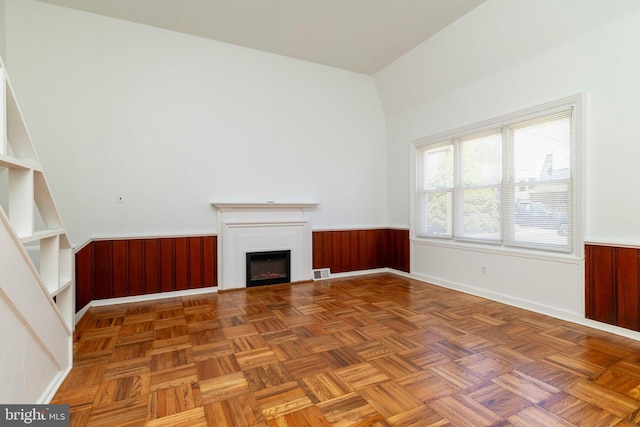1414 Simpson St, Marcus Hook, PA 19061 - unfurnished living room featuring visible vents, wainscoting, wooden walls, and a fireplace