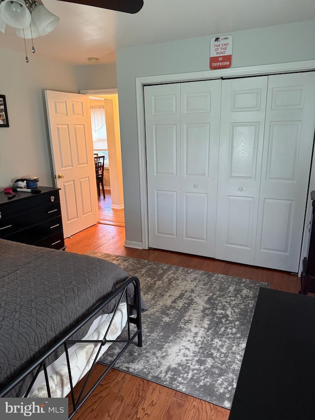 bedroom featuring a closet and wood finished floors