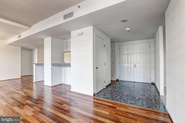 250 President St Unit 308, Baltimore, MD 21202 - interior space with visible vents, baseboards, and wood finished floors