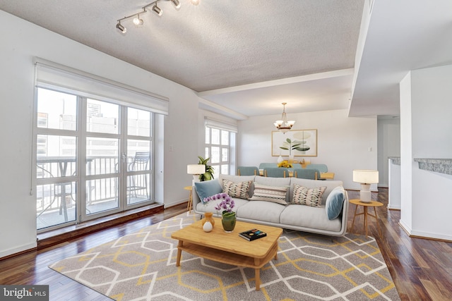 250 President St Unit 308, Baltimore, MD 21202 - living area featuring a textured ceiling, a chandelier, and hardwood / wood-style flooring