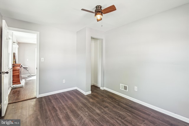 unfurnished bedroom with ceiling fan, baseboards, visible vents, and wood finished floors