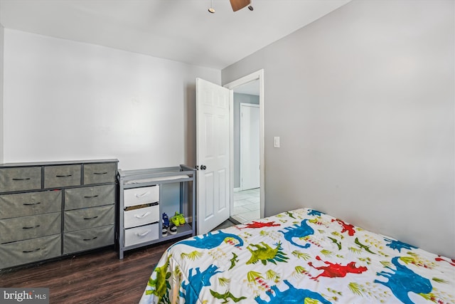 bedroom with dark wood-type flooring and ceiling fan