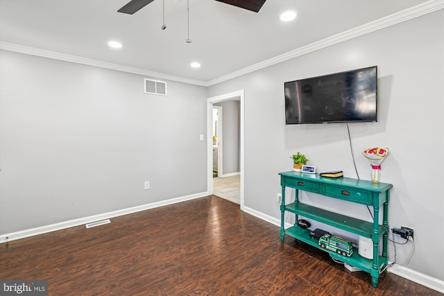 living room featuring baseboards, ornamental molding, and visible vents