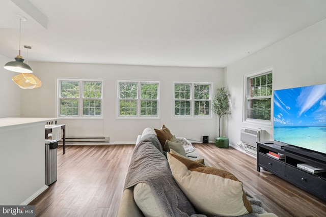 1240 Martha Custis Dr, Alexandria, VA 22302 - living area featuring a baseboard heating unit, plenty of natural light, wood finished floors, and baseboards