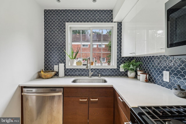1240 Martha Custis Dr, Alexandria, VA 22302 - kitchen with dishwasher, a sink, light countertops, and backsplash