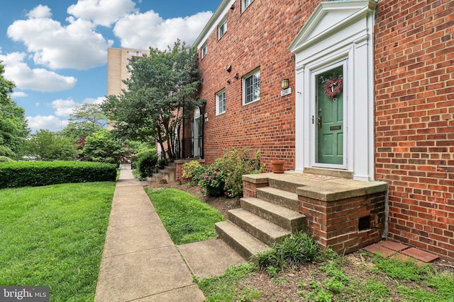 1240 Martha Custis Dr, Alexandria, VA 22302 - doorway to property with brick siding and a yard