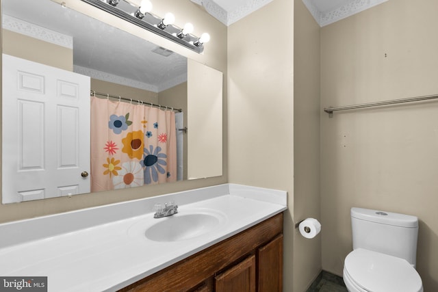 bathroom featuring vanity, curtained shower, and toilet